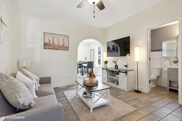 1108 Oakland Ave, Joliet, IL 60435 - living area featuring arched walkways and a ceiling fan