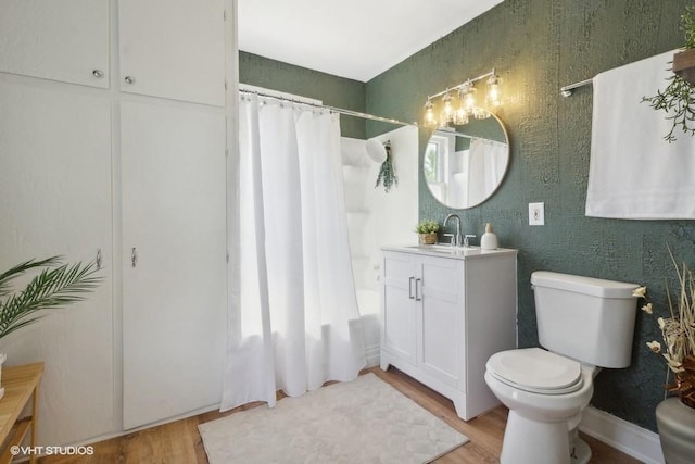 1108 Oakland Ave, Joliet, IL 60435 - full bathroom with vanity, wood finished floors, and shower / bath combo with shower curtain