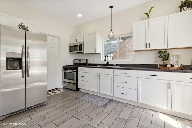 1108 Oakland Ave, Joliet, IL 60435 - kitchen with stainless steel appliances, white cabinets, and recessed lighting