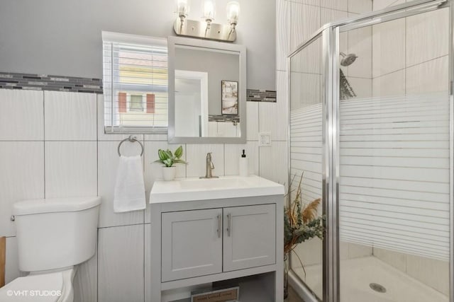 1108 Oakland Ave, Joliet, IL 60435 - full bathroom featuring vanity, tile walls, and a stall shower