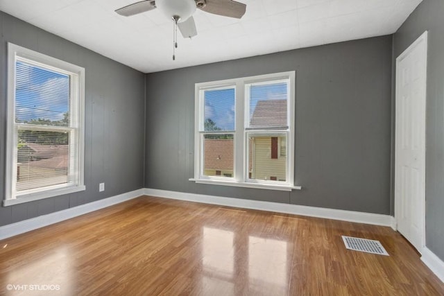 1108 Oakland Ave, Joliet, IL 60435 - spare room featuring wood finished floors and a ceiling fan