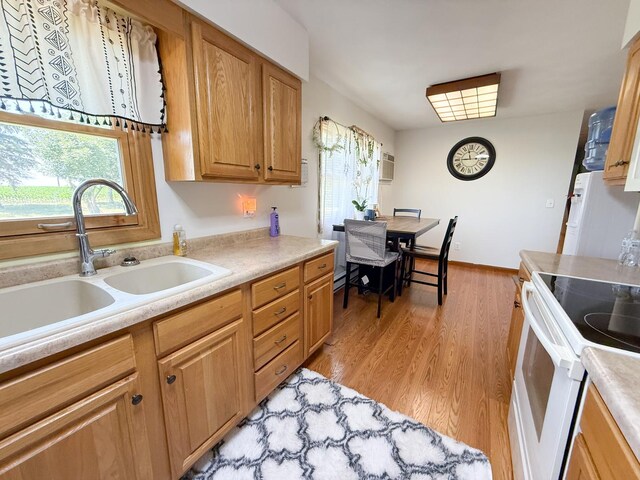 31535 E Thome Rd, Rock Falls, IL 61071 - kitchen featuring white appliances, light wood-style flooring, and light countertops