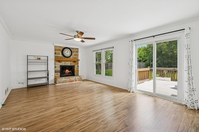 4315 Lombardy Ln, Hoffman Estates, IL 60192 - unfurnished living room featuring crown molding, light wood-style flooring, a ceiling fan, and a fireplace
