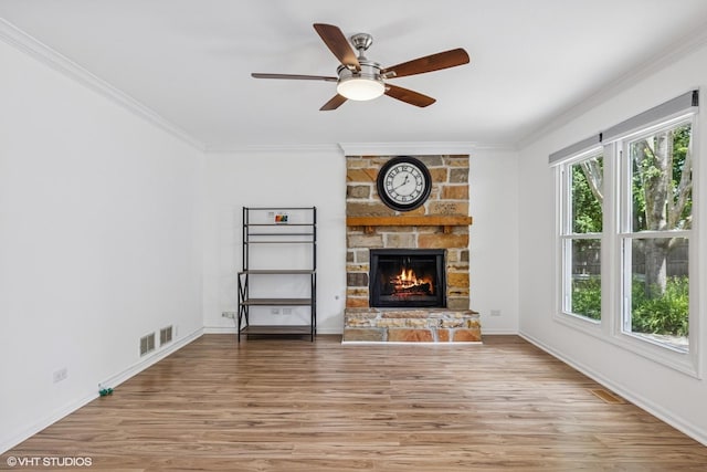 4315 Lombardy Ln, Hoffman Estates, IL 60192 - unfurnished living room featuring ornamental molding, a stone fireplace, light wood-style flooring, and a ceiling fan