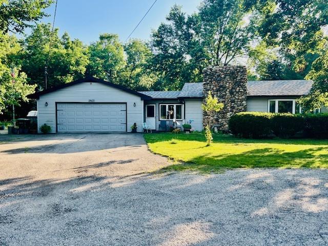 25641 S Oakview Ct, Channahon, IL 60410 - ranch-style home featuring a garage, driveway, a front lawn, and a chimney