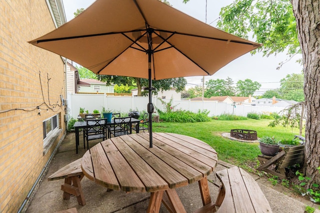 411 W Taylor Rd, Lombard, IL 60148 - fenced backyard with an outdoor fire pit and outdoor dining area