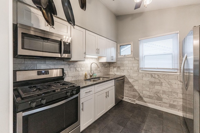 411 W Taylor Rd, Lombard, IL 60148 - kitchen with stainless steel appliances, dark stone counters, white cabinetry, and a ceiling fan