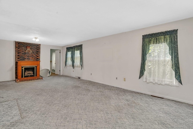 33049 S Symerton Rd, Wilmington, IL 60481 - unfurnished living room with carpet and a fireplace