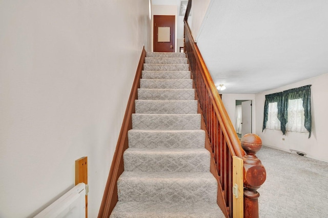33049 S Symerton Rd, Wilmington, IL 60481 - stairs featuring carpet floors and a baseboard heating unit