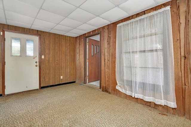 33049 S Symerton Rd, Wilmington, IL 60481 - unfurnished room with wood walls, carpet floors, and a paneled ceiling