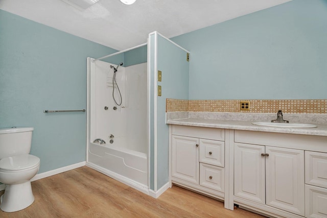 33049 S Symerton Rd, Wilmington, IL 60481 - bathroom with wood finished floors, bathing tub / shower combination, backsplash, and vanity