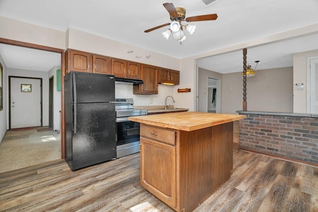 33049 S Symerton Rd, Wilmington, IL 60481 - kitchen featuring freestanding refrigerator, electric stove, butcher block countertops, under cabinet range hood, and light wood-style flooring