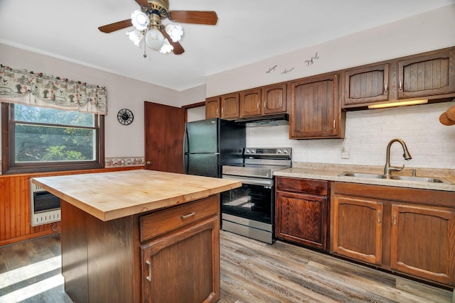 33049 S Symerton Rd, Wilmington, IL 60481 - kitchen with electric range, butcher block counters, freestanding refrigerator, light wood-style floors, and a ceiling fan
