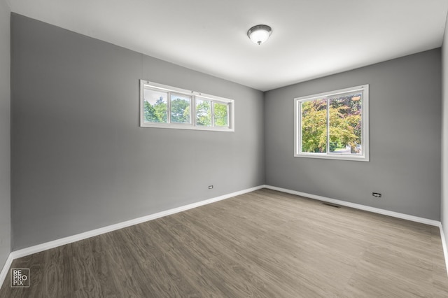 36665 N Traer Ter, Gurnee, IL 60031 - spare room featuring baseboards and wood finished floors