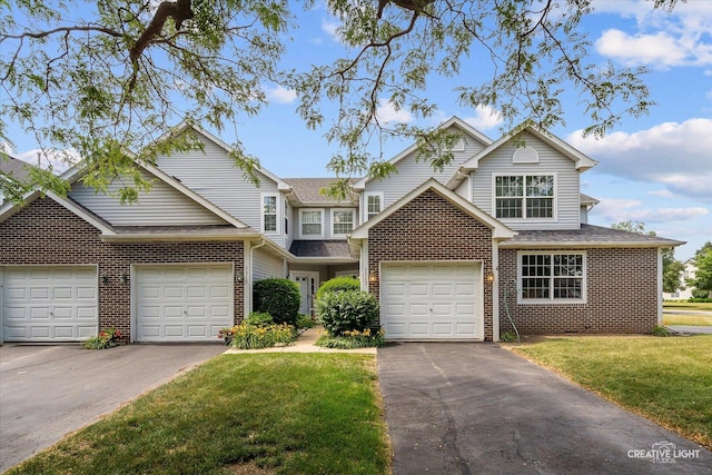 1517 Stoneridge Ct, Yorkville, IL 60560 - traditional home featuring brick siding, a front yard, and driveway