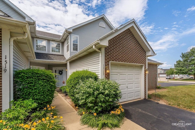 1517 Stoneridge Ct, Yorkville, IL 60560 - view of side of home featuring asphalt driveway and an attached garage