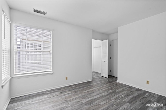 1517 Stoneridge Ct, Yorkville, IL 60560 - unfurnished bedroom with wood finished floors and multiple windows