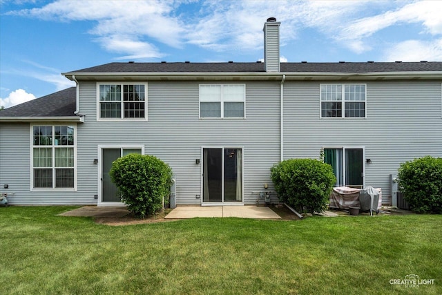 1517 Stoneridge Ct, Yorkville, IL 60560 - rear view of house with a lawn, a chimney, and a patio area