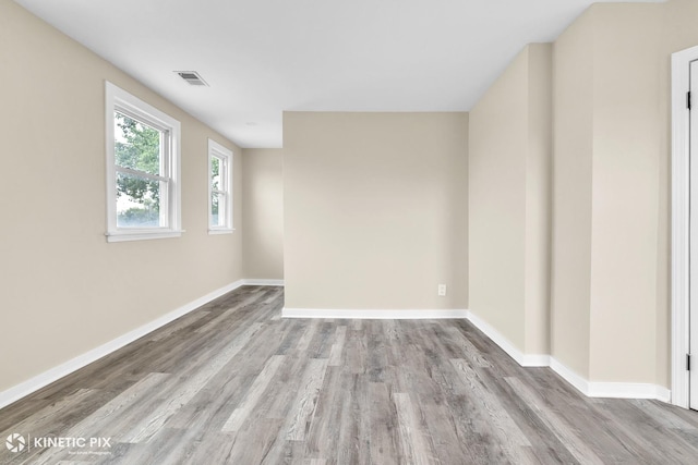 9613 S Yale Ave, Chicago, IL 60628 - empty room featuring wood finished floors and baseboards