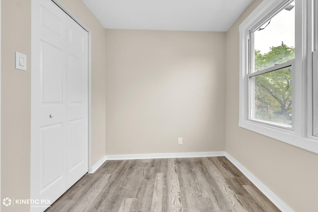 9613 S Yale Ave, Chicago, IL 60628 - unfurnished bedroom featuring light wood finished floors and a closet