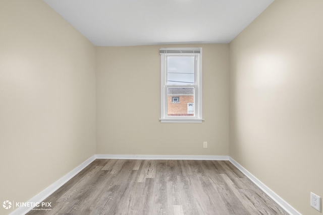 9613 S Yale Ave, Chicago, IL 60628 - spare room featuring wood finished floors and baseboards