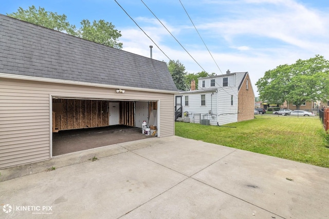 9613 S Yale Ave, Chicago, IL 60628 - view of property exterior featuring a lawn, roof with shingles, and an outdoor structure