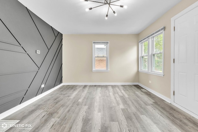 9613 S Yale Ave, Chicago, IL 60628 - unfurnished bedroom featuring a chandelier and light wood-type flooring