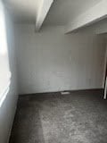 829 E 48th St Unit D, Chicago, IL 60615 - spare room featuring beamed ceiling