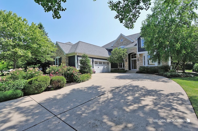 905 Burnham Ct, Aurora, IL 60502 - view of front of property with stone siding, a garage, and concrete driveway