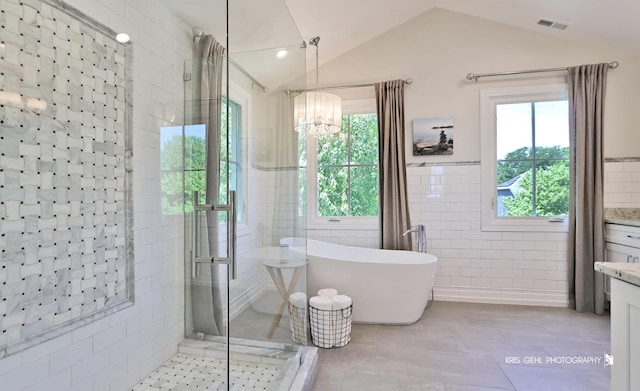 905 Burnham Ct, Aurora, IL 60502 - full bath with vanity, tile walls, a freestanding bath, a stall shower, and tile patterned flooring