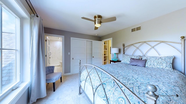 905 Burnham Ct, Aurora, IL 60502 - bedroom featuring light colored carpet, a closet, and ceiling fan