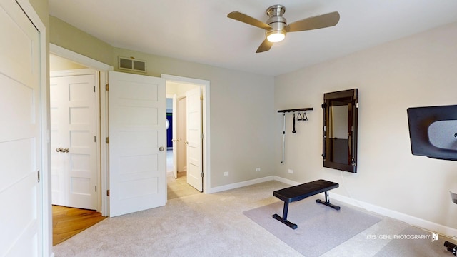 905 Burnham Ct, Aurora, IL 60502 - exercise room with a ceiling fan and light carpet