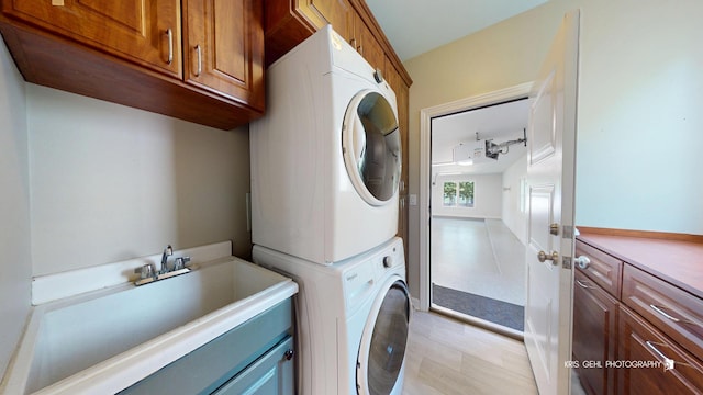 905 Burnham Ct, Aurora, IL 60502 - washroom featuring estacked washer and dryer and cabinet space