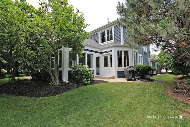 905 Burnham Ct, Aurora, IL 60502 - back of house with a yard and a shingled roof