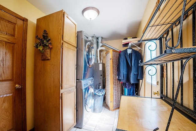 712 Mchenry Ave, Mchenry, IL 60050 - spacious closet featuring stacked washer / drying machine and light tile patterned flooring