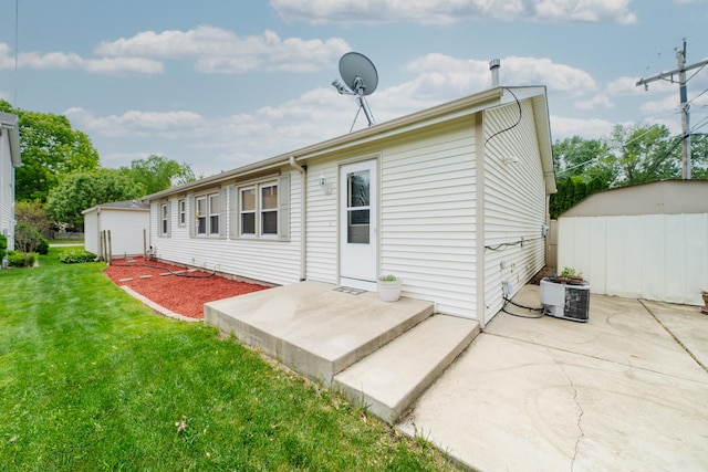 712 Mchenry Ave, Mchenry, IL 60050 - rear view of property featuring a yard and a patio
