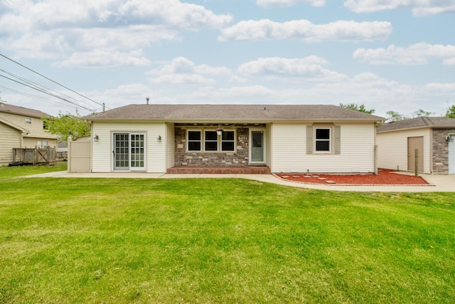 712 Mchenry Ave, Mchenry, IL 60050 - back of house featuring a patio area, an outbuilding, and stone siding