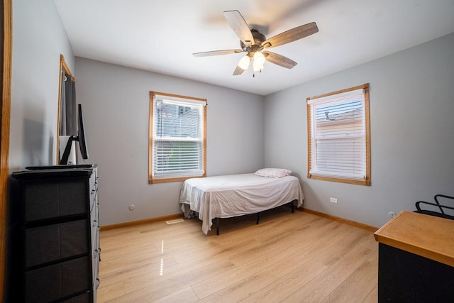 712 Mchenry Ave, Mchenry, IL 60050 - bedroom with multiple windows, light wood-type flooring, and ceiling fan