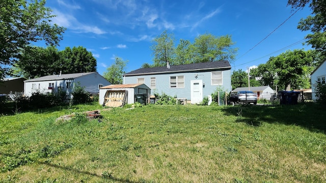 2637 Yeoman St, Waukegan, IL 60087 - rear view of house with a storage shed