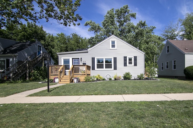 214 S Hickory St, Manteno, IL 60950 - view of front of home featuring stairway, a deck, and a front lawn