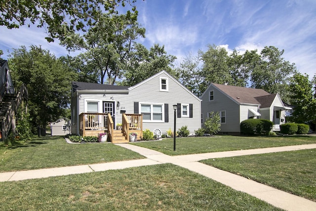 214 S Hickory St, Manteno, IL 60950 - view of front of house with a front yard and a deck