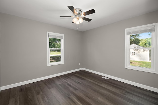 214 S Hickory St, Manteno, IL 60950 - spare room featuring plenty of natural light, dark wood-style floors, and ceiling fan