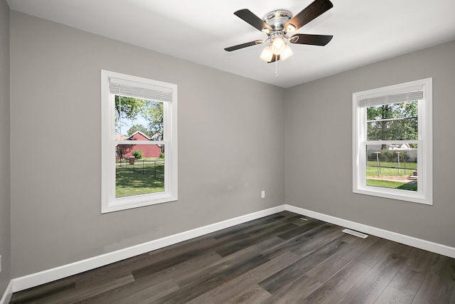 214 S Hickory St, Manteno, IL 60950 - unfurnished room with plenty of natural light, dark wood-type flooring, and ceiling fan