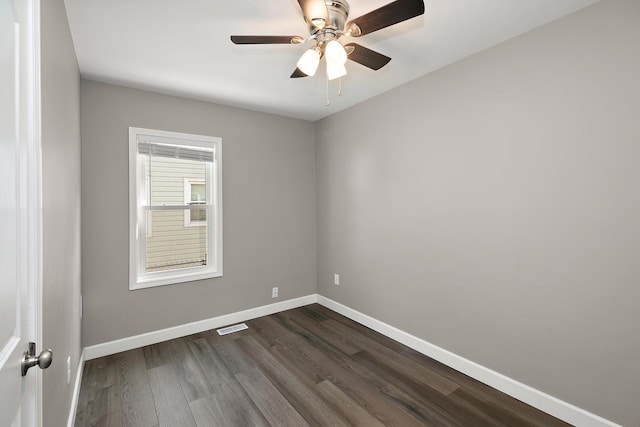 214 S Hickory St, Manteno, IL 60950 - unfurnished room featuring dark wood-type flooring and a ceiling fan