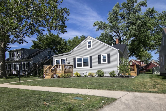 214 S Hickory St, Manteno, IL 60950 - bungalow-style house featuring a deck, a front yard, and a chimney