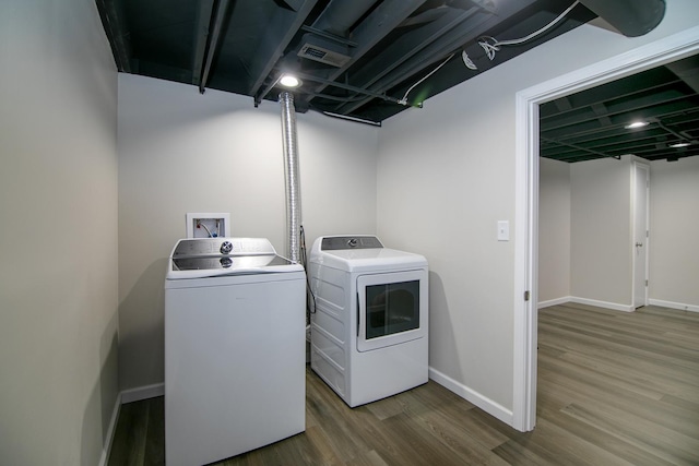 214 S Hickory St, Manteno, IL 60950 - laundry room with washer and dryer and wood finished floors