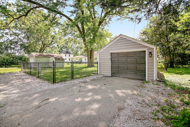 214 S Hickory St, Manteno, IL 60950 - detached garage with driveway and a gate
