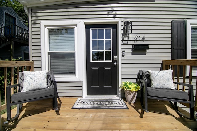 214 S Hickory St, Manteno, IL 60950 - doorway to property featuring a wooden deck