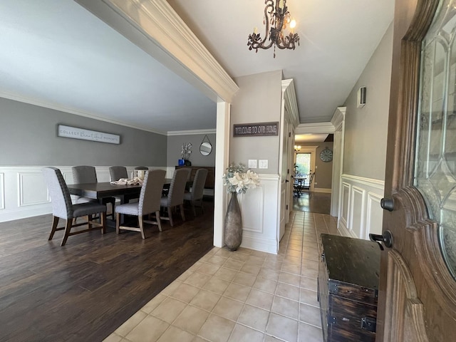 13745 S King Rd, Homer Glen, IL 60491 - foyer with a decorative wall, a chandelier, tile patterned flooring, a wainscoted wall, and ornamental molding