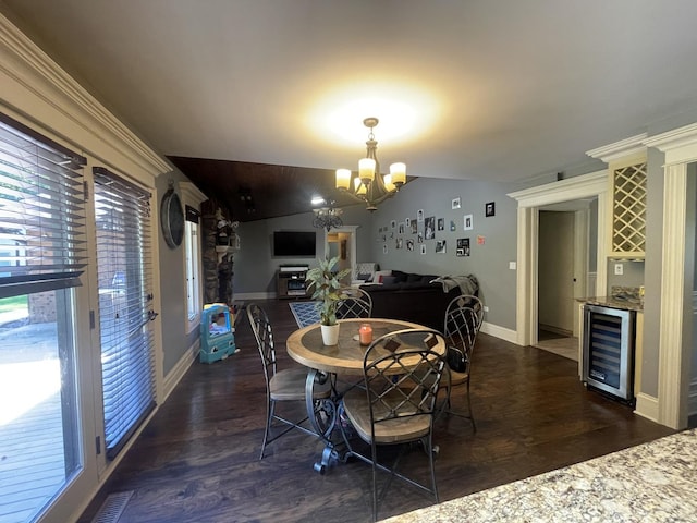13745 S King Rd, Homer Glen, IL 60491 - dining space featuring beverage cooler, a chandelier, dark wood-style floors, and bar area